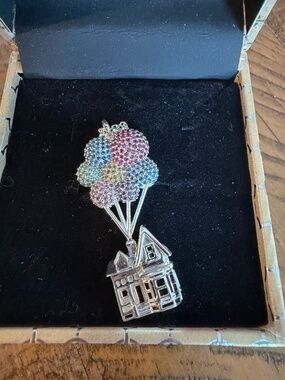 Rebecca Hook Disney Up House necklace, featuring a sterling silver house pendant